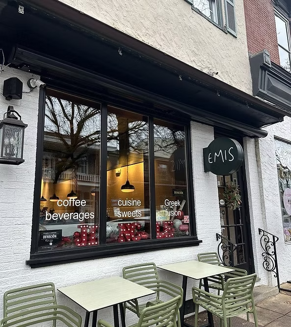 Cafe Emis storefront with sidewalk tables in downtown Kennett Square, PA