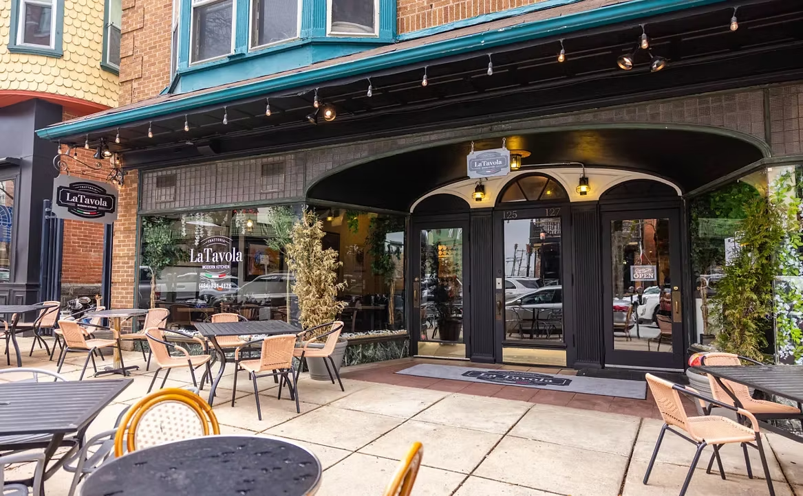 Trattoria La Tavola storefront with sidewalk tables on State Street in Kennett Square, PA